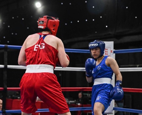 Rhea Kanu (blue vest) faces off against Abbie McKay (red vest) in the final of the GB Elite Three Nations boxing championship.